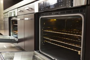Closeup of open oven in commercial kitchen